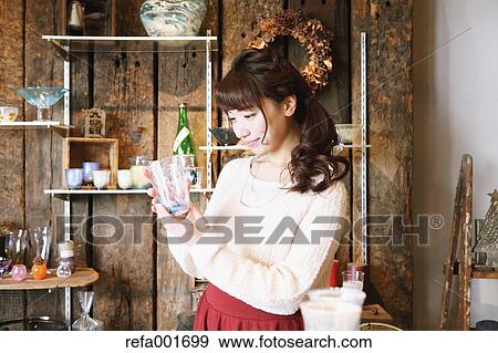 Young Japanese woman enjoying visit to glass workshop in Kawagoe, Japan View Large Photo Image Stock Photo - Young Japanese woman enjoying visit to glass workshop in Kawagoe, Japan. Fotosearch