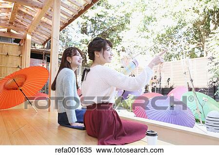 Young Japanese women enjoying foot spa in Kawagoe, Japan View Large Photo Image Stock Photography - Young Japanese women enjoying foot spa in Kawagoe, Japan. Fotosearch