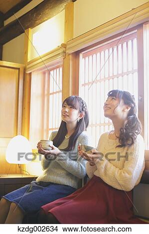 Picture - Young Japanese women enjoying Maccha green tea in Kawagoe, Japan. Fotosearch