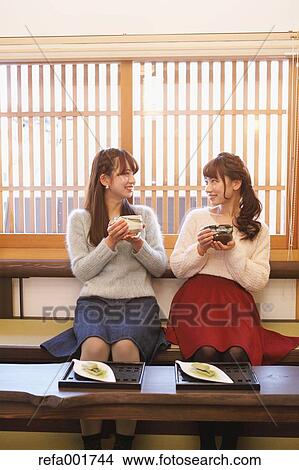 Young Japanese women enjoying Maccha green tea in Kawagoe, Japan View Large Photo Image Picture - Young Japanese women enjoying Maccha green tea in Kawagoe, Japan. Fotosearch