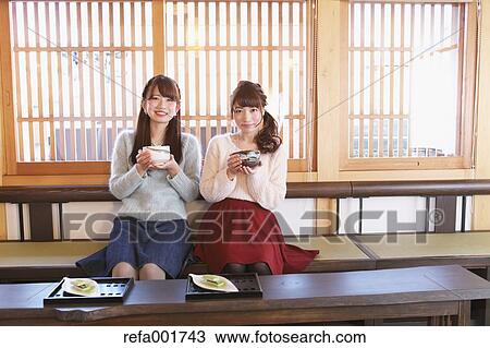 Young Japanese women enjoying Maccha green tea in Kawagoe, Japan View Large Photo Image Stock Image - Young Japanese women enjoying Maccha green tea in Kawagoe, Japan. Fotosearch