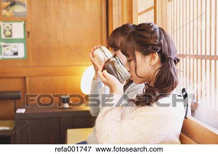 Young Japanese women enjoying Maccha green tea in Kawagoe, Japan View Large Photo Image Stock Photo - Young Japanese women enjoying Maccha green tea in Kawagoe, Japan. Fotosearch