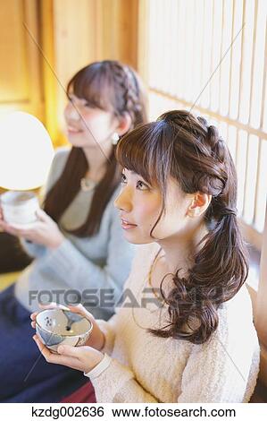 Young Japanese women enjoying Maccha green tea in Kawagoe, Japan View Large Photo Image Stock Photograph - Young Japanese women enjoying Maccha green tea in Kawagoe, Japan. Fotosearch
