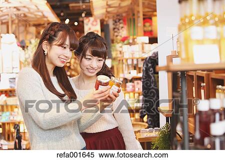 Stock Photography - Young Japanese women enjoying shopping in Kawagoe, Japan. Fotosearch