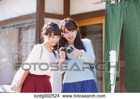 Picture - Young Japanese women enjoying trip in Kawagoe, Japan. Fotosearch