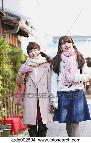 Picture - Young Japanese women enjoying trip in Kawagoe, Japan. Fotosearch