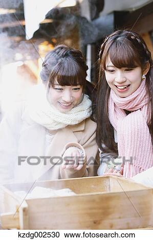 Stock Image - Young Japanese women enjoying trip in Kawagoe, Japan. Fotosearch
