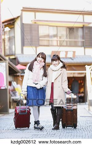 Young Japanese women enjoying trip in Kawagoe, Japan View Large Photo Image Stock Image - Young Japanese women enjoying trip in Kawagoe, Japan. Fotosearch