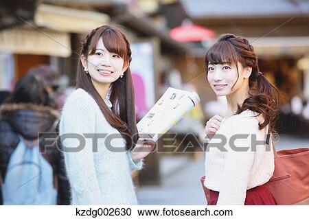 Stock Image - Young Japanese women enjoying trip in Kawagoe, Japan. Fotosearch