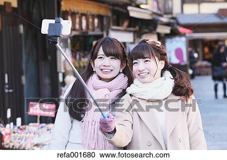 Stock Image - Young Japanese women enjoying trip in Kawagoe, Japan. Fotosearch