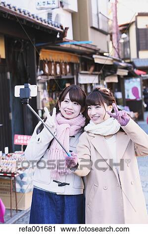 Young Japanese women enjoying trip in Kawagoe, Japan View Large Photo Image Stock Image - Young Japanese women enjoying trip in Kawagoe, Japan. Fotosearch