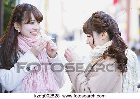 Stock Photo - Young Japanese women enjoying trip in Kawagoe, Japan. Fotosearch