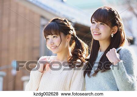 Stock Photo - Young Japanese women enjoying trip in Kawagoe, Japan. Fotosearch