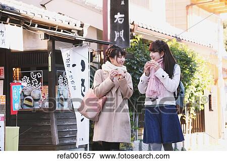 Stock Photo - Young Japanese women enjoying trip in Kawagoe, Japan. Fotosearch