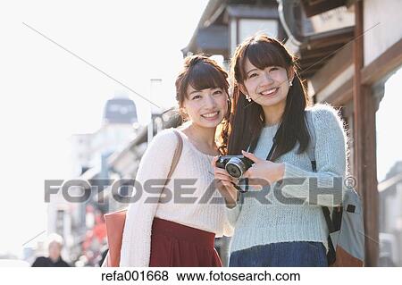 Stock Photo - Young Japanese women enjoying trip in Kawagoe, Japan. Fotosearch
