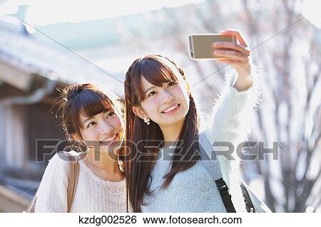 Young Japanese women enjoying trip in Kawagoe, Japan View Large Photo Image Stock Photograph - Young Japanese women enjoying trip in Kawagoe, Japan. Fotosearch