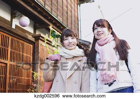 Stock Photograph - Young Japanese women enjoying trip in Kawagoe, Japan. Fotosearch