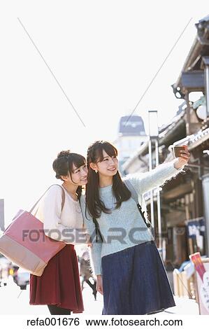 Young Japanese women enjoying trip in Kawagoe, Japan View Large Photo Image Stock Photograph - Young Japanese women enjoying trip in Kawagoe, Japan. Fotosearch