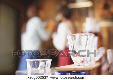 Stock Photo - Young Japanese women enjoying visit to glass workshop in Kawagoe, Japan. Fotosearch