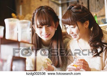 Young Japanese women enjoying visit to glass workshop in Kawagoe, Japan View Large Photo Image Stock Photograph - Young Japanese women enjoying visit to glass workshop in Kawagoe, Japan. Fotosearch