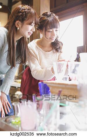 Young Japanese women enjoying visit to glass workshop in Kawagoe, Japan View Large Photo Image Stock Photography - Young Japanese women enjoying visit to glass workshop in Kawagoe, Japan. Fotosearch