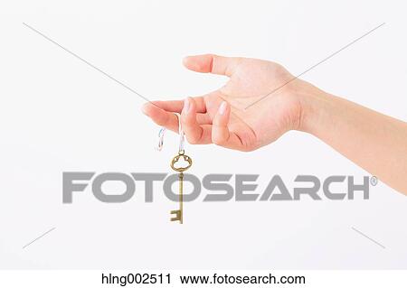 Young woman holding key View Large Photo Image Stock Image - Young woman holding key. Fotosearch