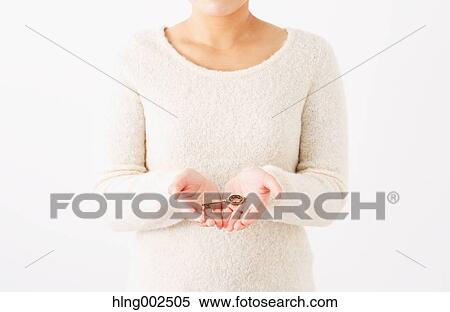 Young woman holding key View Large Photo Image Stock Photography - Young woman holding key. Fotosearch