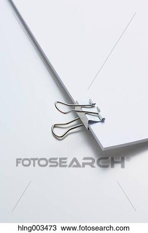 Alligator clip on paper View Large Photo Image Stock Image - Alligator clip on paper. Fotosearch