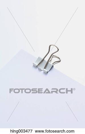 Alligator clip on paper View Large Photo Image Stock Photo - Alligator clip on paper. Fotosearch