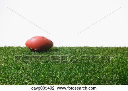 American football ball on grass View Large Photo Image Stock Image - American football ball on grass. Fotosearch