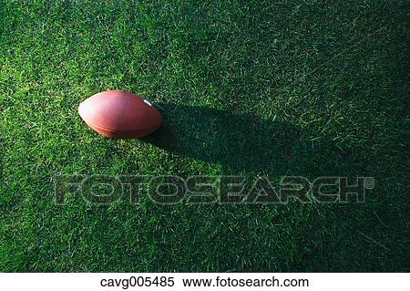 American football ball on grass View Large Photo Image Stock Photography - American football ball on grass. Fotosearch