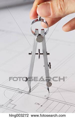 Stock Image - Architect working in his studio. Fotosearch