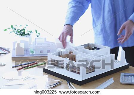 Architect working in his studio View Large Photo Image Stock Photography - Architect working in his studio. Fotosearch
