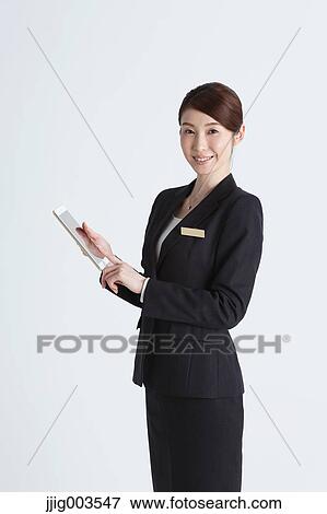 Attractive Japanese concierge View Large Photo Image Stock Photo - Attractive Japanese concierge. Fotosearch