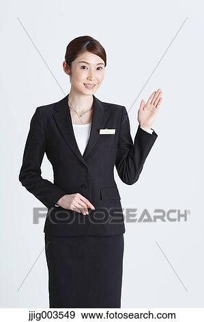 Attractive Japanese concierge View Large Photo Image Stock Photo - Attractive Japanese concierge. Fotosearch