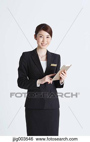 Attractive Japanese concierge View Large Photo Image Stock Photograph - Attractive Japanese concierge. Fotosearch
