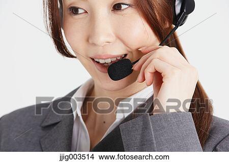 Picture - Attractive Japanese office worker. Fotosearch