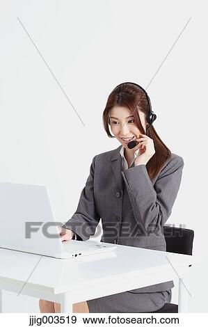 Attractive Japanese office worker View Large Photo Image Stock Photo - Attractive Japanese office worker. Fotosearch