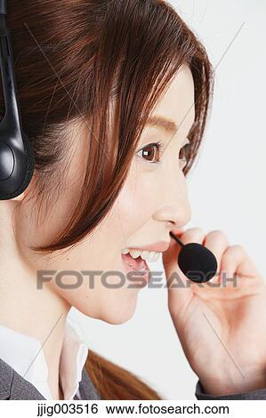 Stock Photograph - Attractive Japanese office worker. Fotosearch