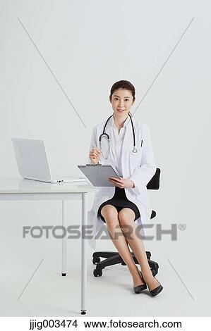 Attractive Japanese woman doctor View Large Photo Image Picture - Attractive Japanese woman doctor. Fotosearch