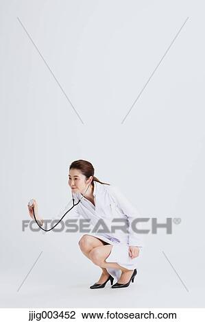 Stock Image - Attractive Japanese woman doctor. Fotosearch