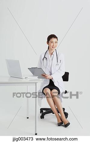 Stock Image - Attractive Japanese woman doctor. Fotosearch