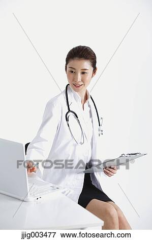 Stock Photo - Attractive Japanese woman doctor. Fotosearch