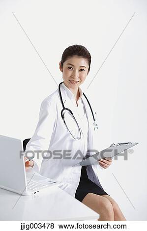 Stock Photo - Attractive Japanese woman doctor. Fotosearch