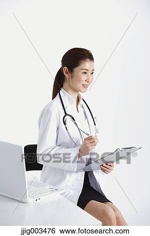 Stock Photograph - Attractive Japanese woman doctor. Fotosearch