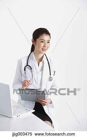 Stock Photography - Attractive Japanese woman doctor. Fotosearch