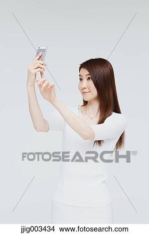 Attractive Japanese woman View Large Photo Image Picture - Attractive Japanese woman. Fotosearch