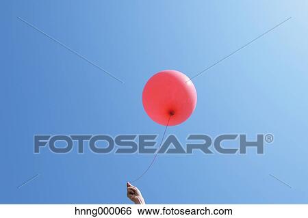 Balloon in the sky View Large Photo Image Stock Photograph - Balloon in the sky. Fotosearch