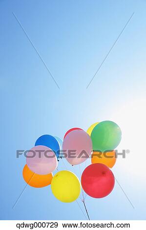 Balloons in the sky View Large Photo Image Stock Photo - Balloons in the sky. Fotosearch