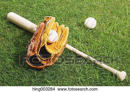 Baseball equipment on grass View Large Photo Image Picture - Baseball equipment on grass. Fotosearch